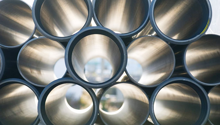 Many aluminum pipes stacked on top of each other