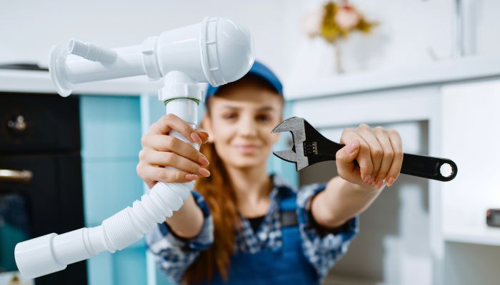 professional plumber taking holding tools 